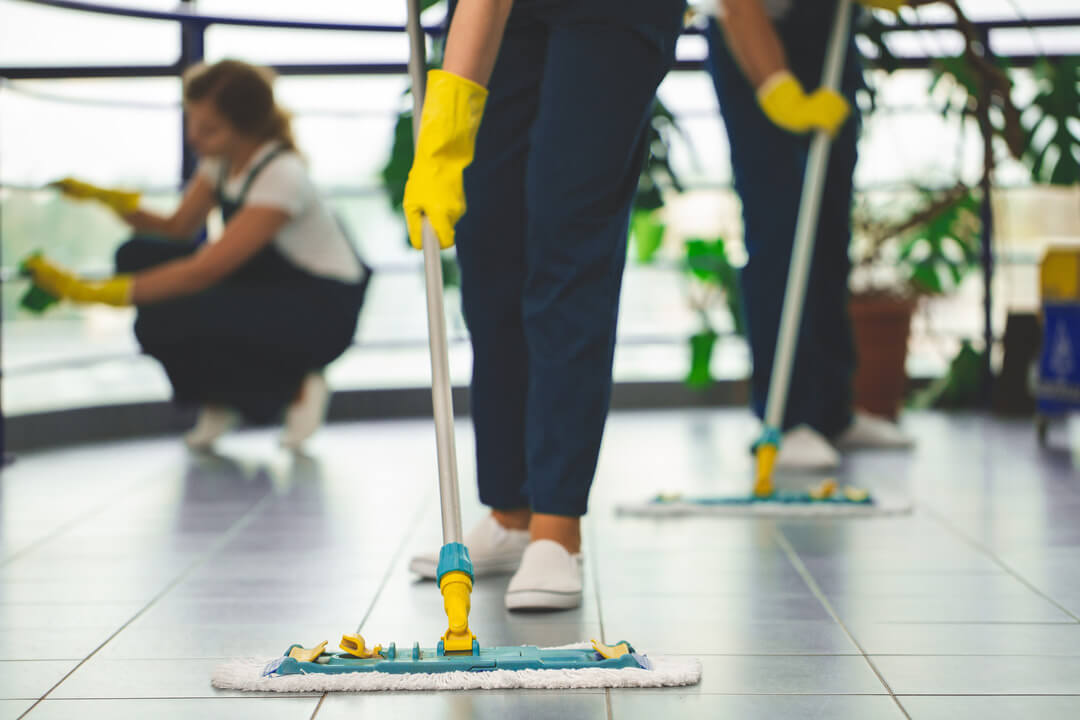 Image of a person cleaning the floor